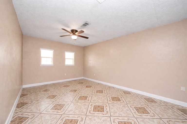 2914 Dragonwick Drive Houston, TX 77045 - Photo 19 of 37 a view of an empty room with a window
