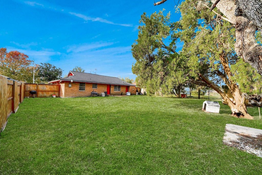 2914 Dragonwick Drive Houston, TX 77045 - Photo 29 of 37 a view of a house with a big yard