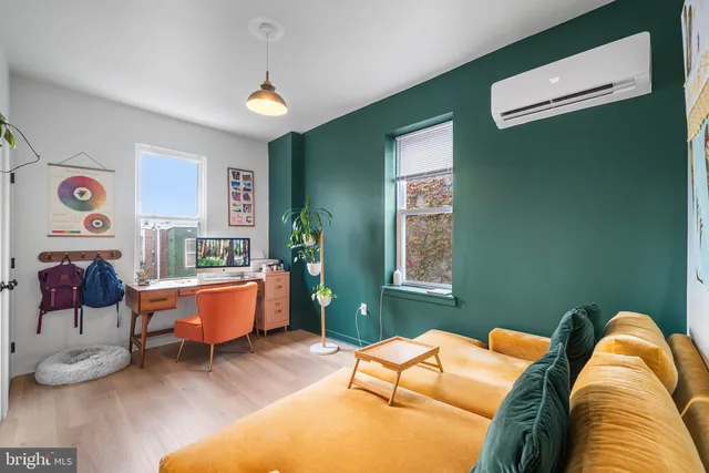 a living room with furniture and window