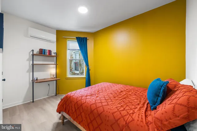 a bedroom with a bed and cupboard