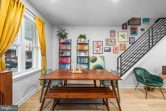 a reading room with furniture and a window