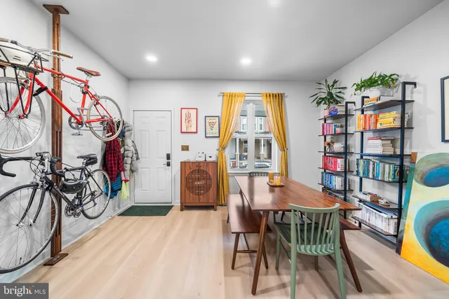 a view of a dining room with furniture and a window
