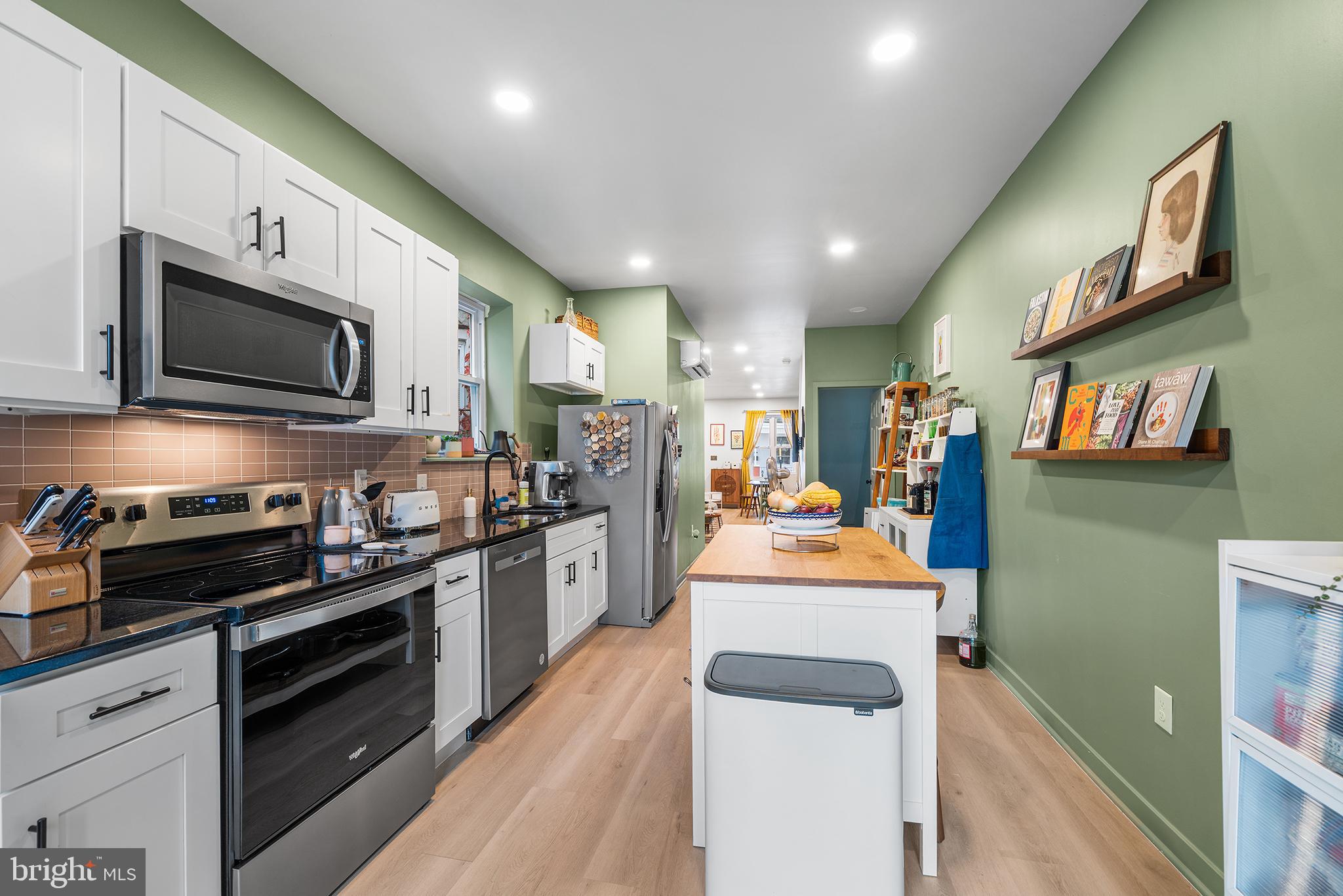 5426 Irving Street Philadelphia, PA 19139 - Photo 8 of 28 a large kitchen with stainless steel appliances granite countertop a lot of counter space cabinets and a stove