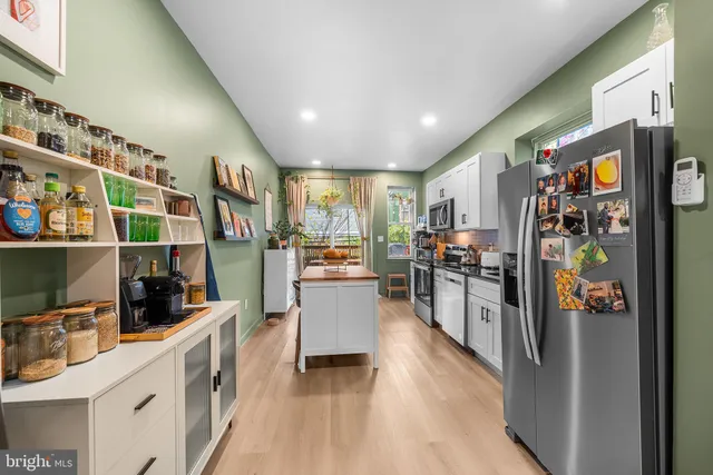 a kitchen with counter top space and stainless steel appliances