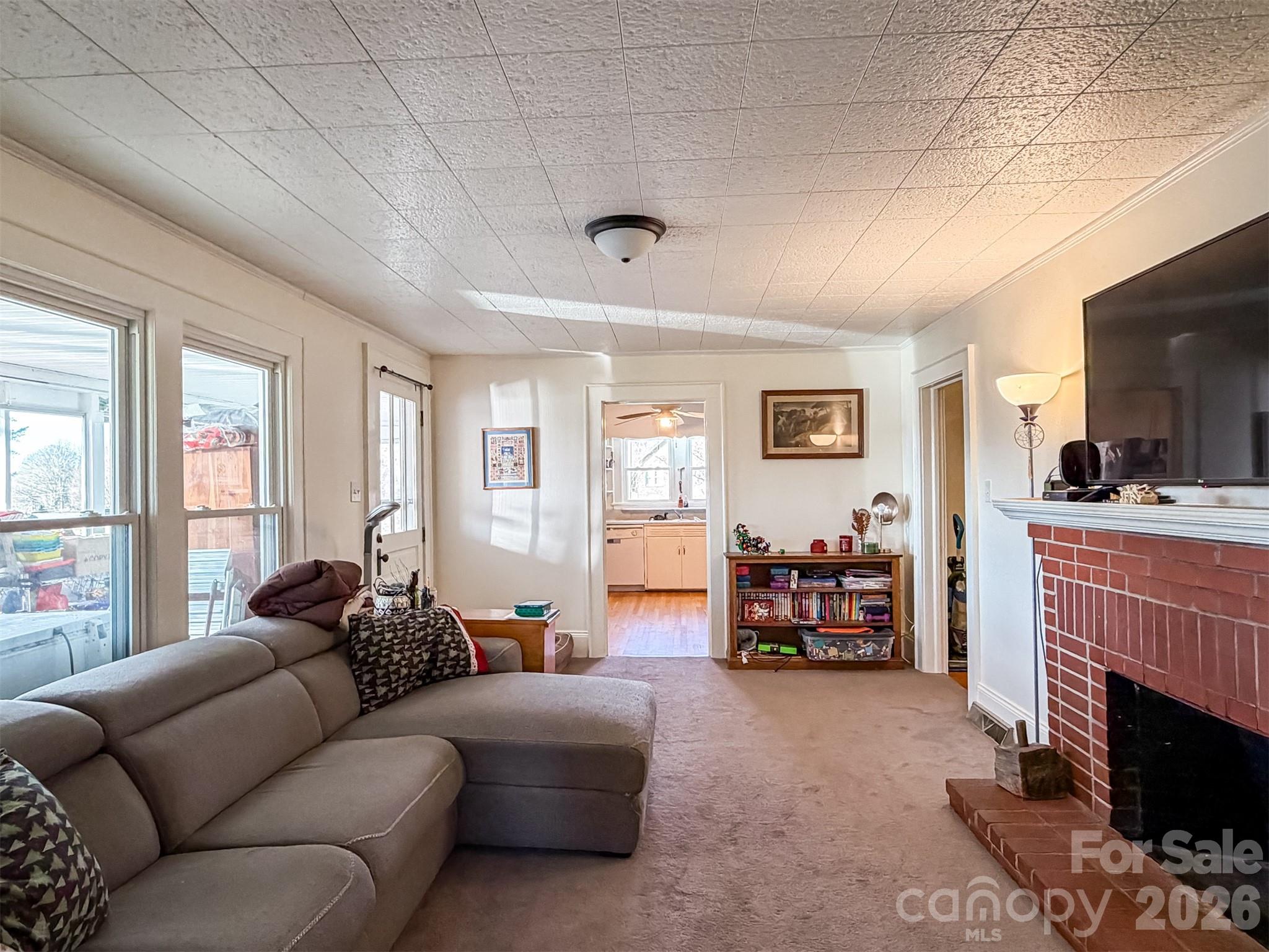 4363 Section House Road Hickory, NC 28601 - Photo 11 of 48 a living room with furniture and a fireplace