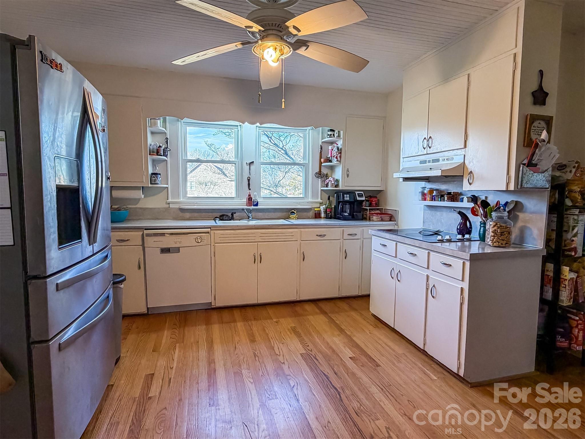 4363 Section House Road Hickory, NC 28601 - Photo 15 of 48 a kitchen with stainless steel appliances a sink cabinets and wooden floor
