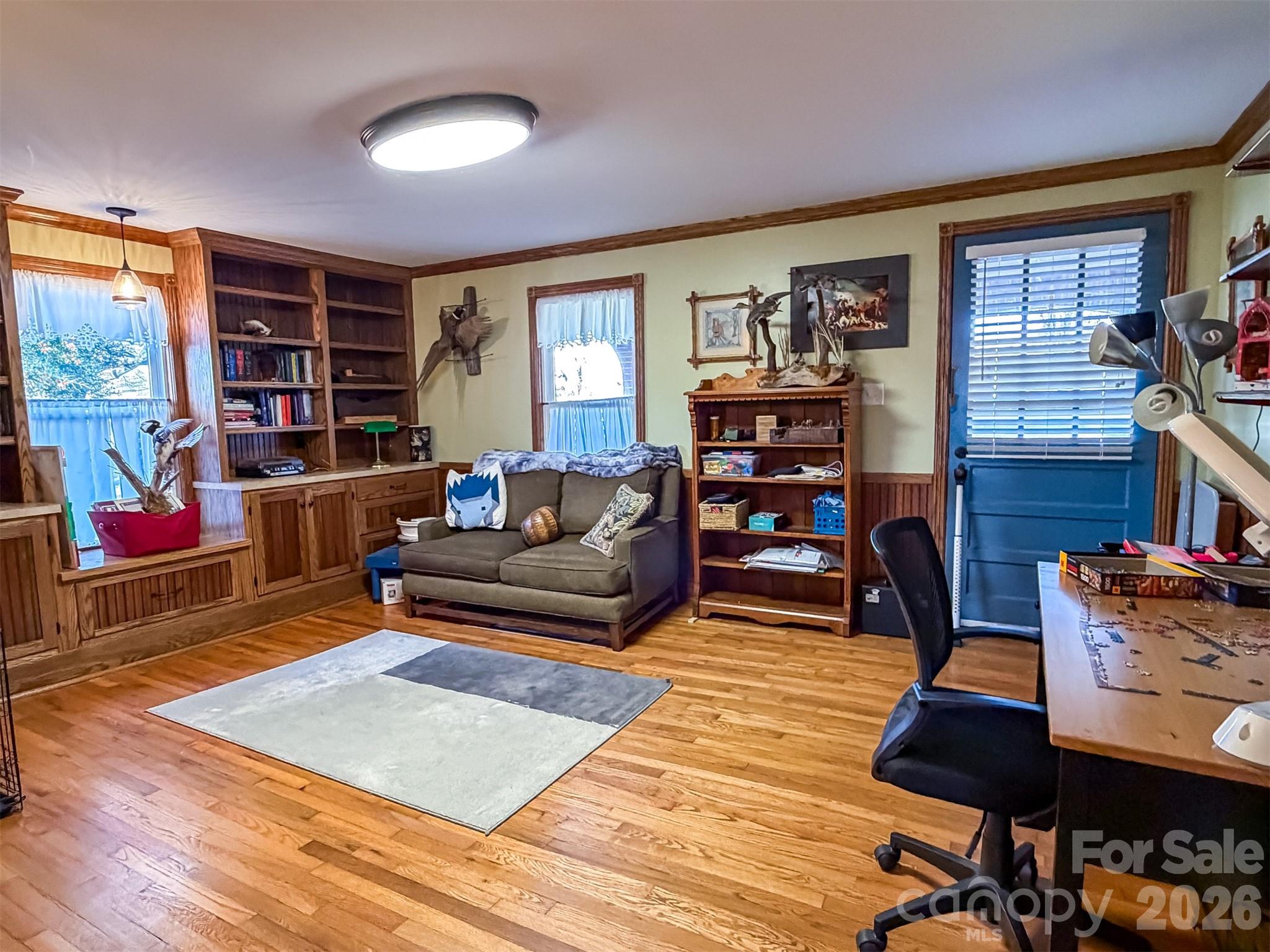 4363 Section House Road Hickory, NC 28601 - Photo 22 of 48 a living room with furniture a bookshelf and a window