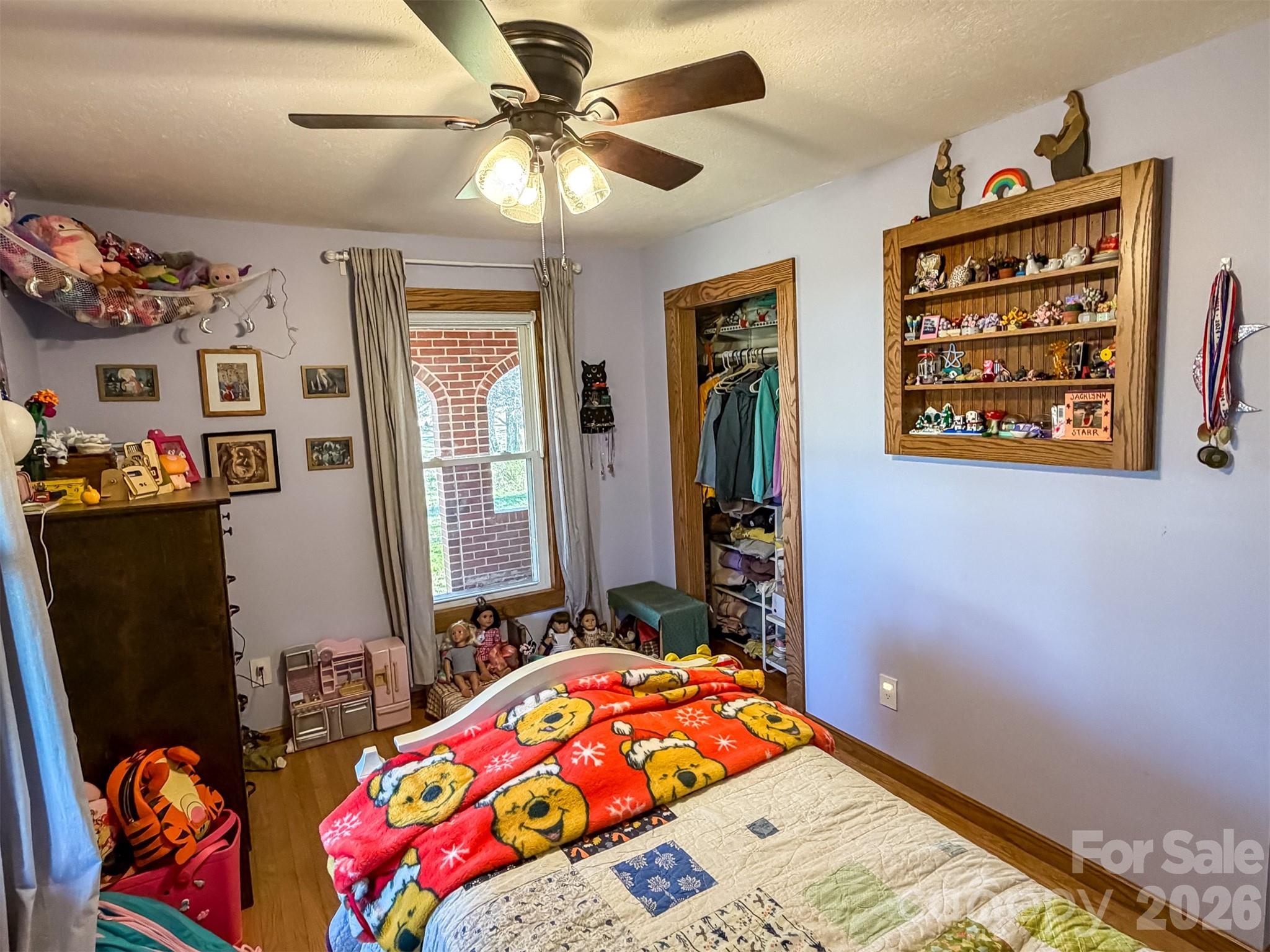 4363 Section House Road Hickory, NC 28601 - Photo 26 of 48 a bedroom with a bed a dresser and book shelf
