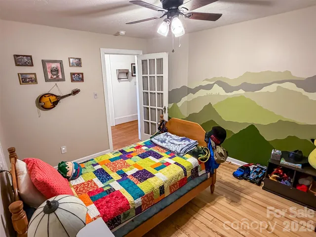 a bedroom with a bed and a couch