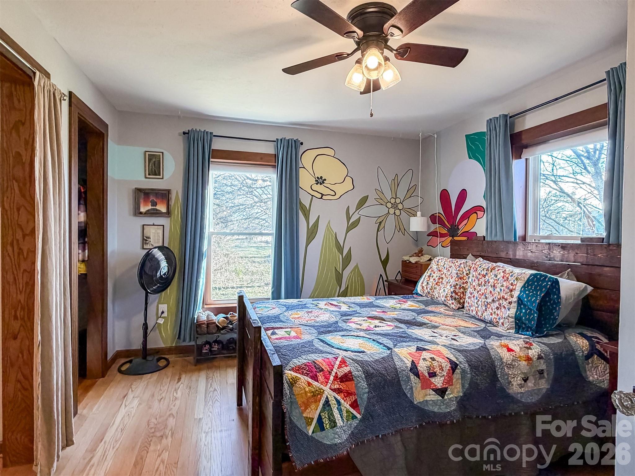 4363 Section House Road Hickory, NC 28601 - Photo 32 of 48 a bedroom with a bed and a chandelier