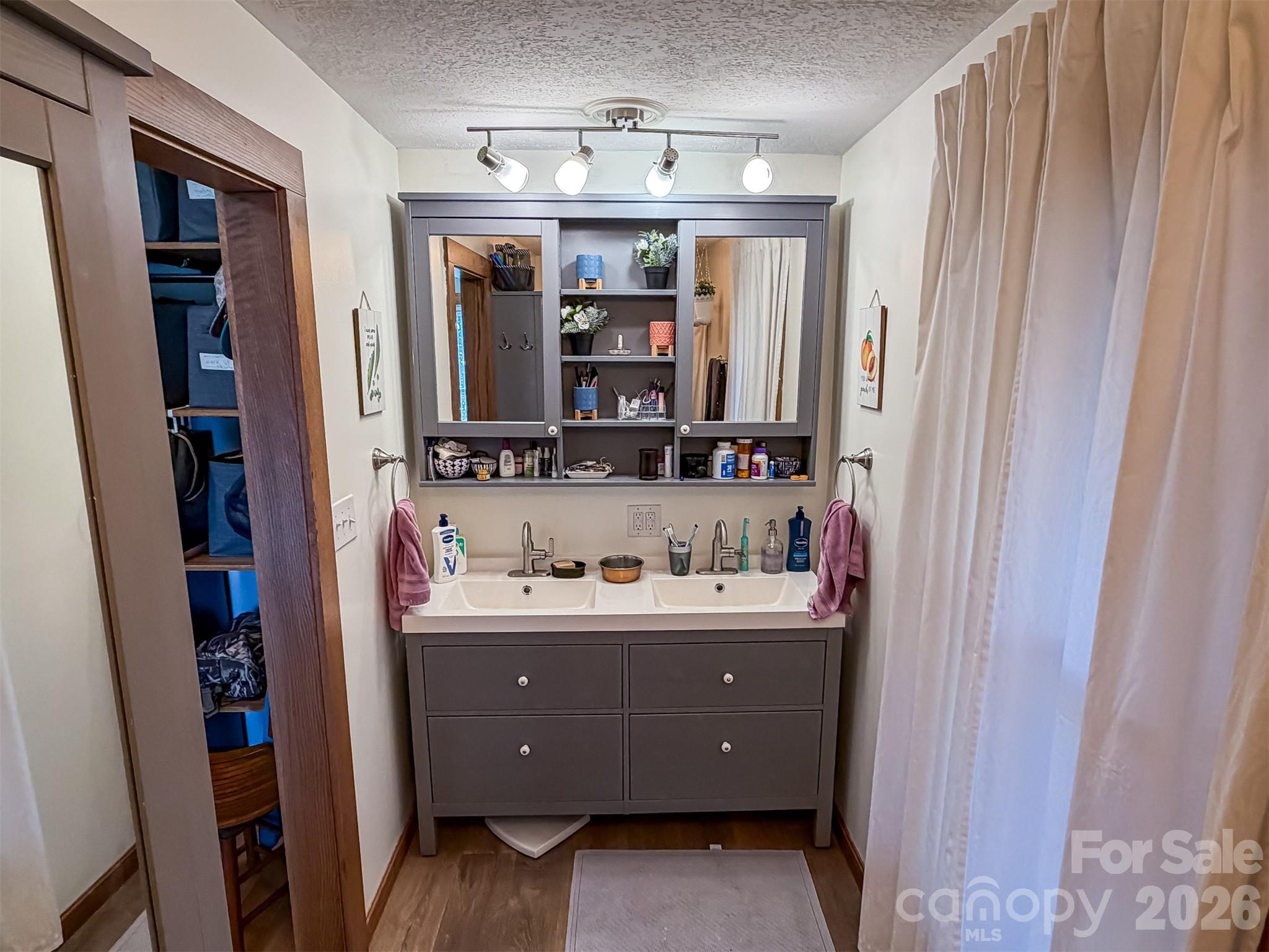 4363 Section House Road Hickory, NC 28601 - Photo 38 of 48 a room with a sink a mirror and a cabinets