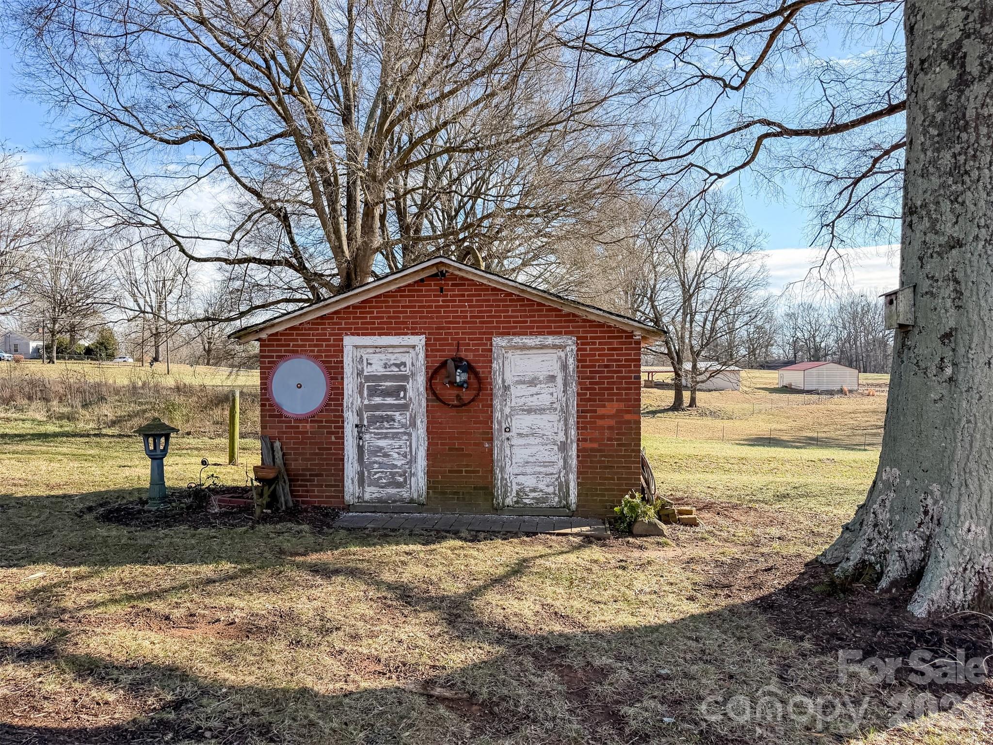 4363 Section House Road Hickory, NC 28601 - Photo 41 of 48 a view of a house with a yard tree and wooden fence