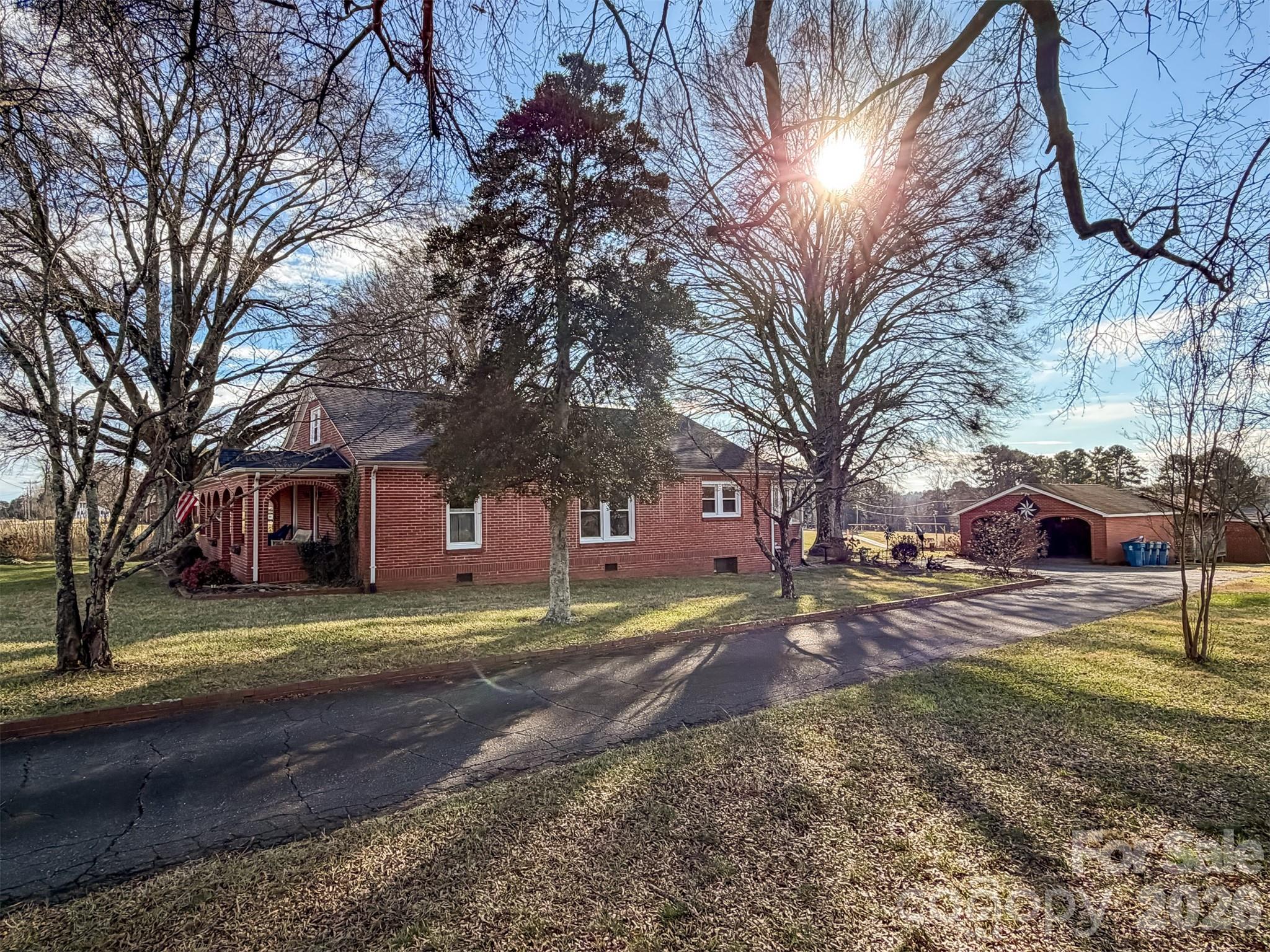 4363 Section House Road Hickory, NC 28601 - Photo 6 of 48 a brick house with trees in front of it