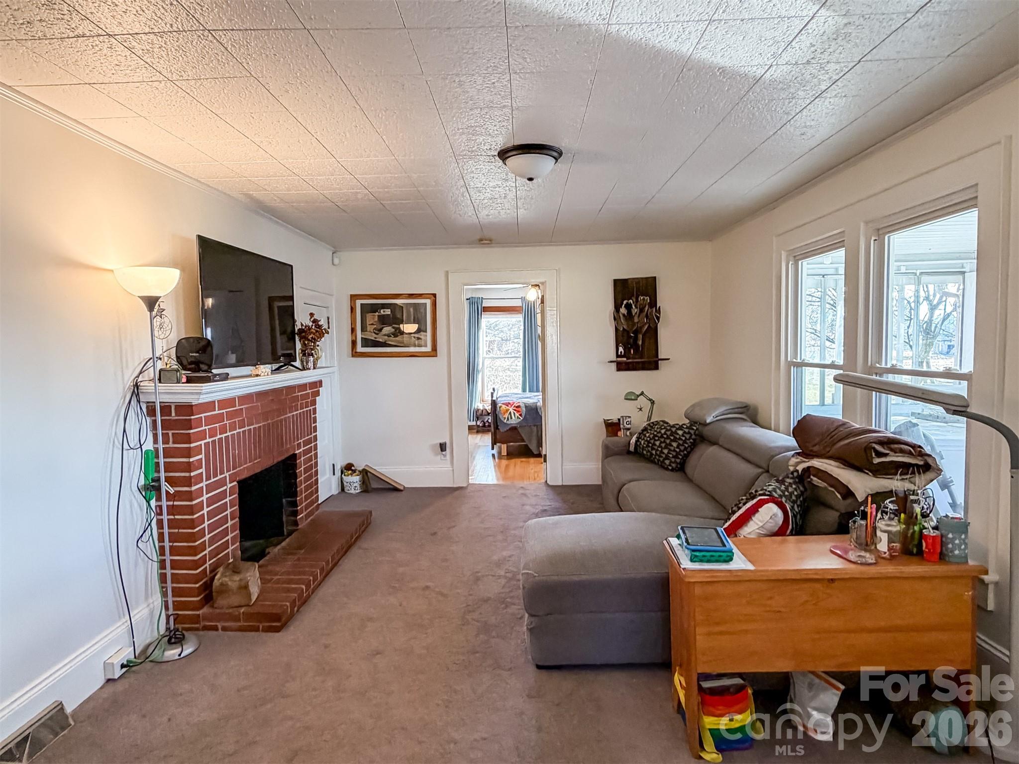 4363 Section House Road Hickory, NC 28601 - Photo 9 of 48 a living room with furniture and a fireplace