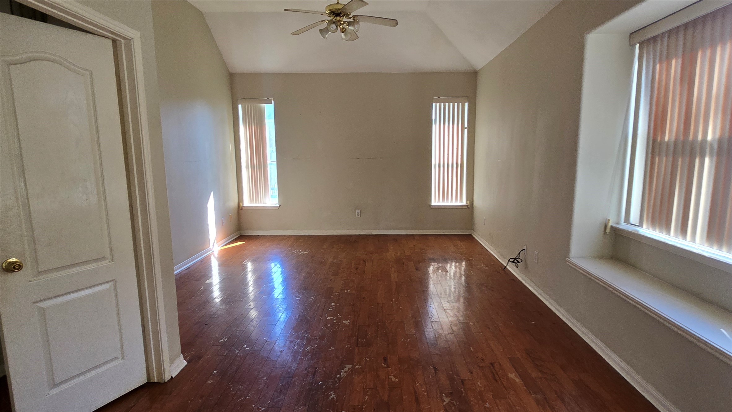 131 Annes Way Stafford, TX 77477 - Photo 15 of 25 a view of an empty room with wooden floor and a window