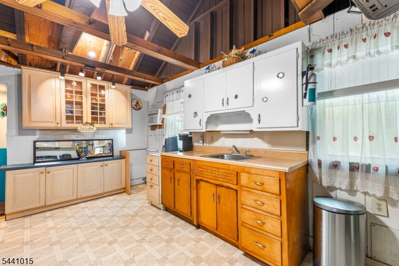 308 Lakeside Avenue Hopatcong, NJ 07821 - Photo 6 of 13 a kitchen with stainless steel appliances granite countertop a sink and cabinets