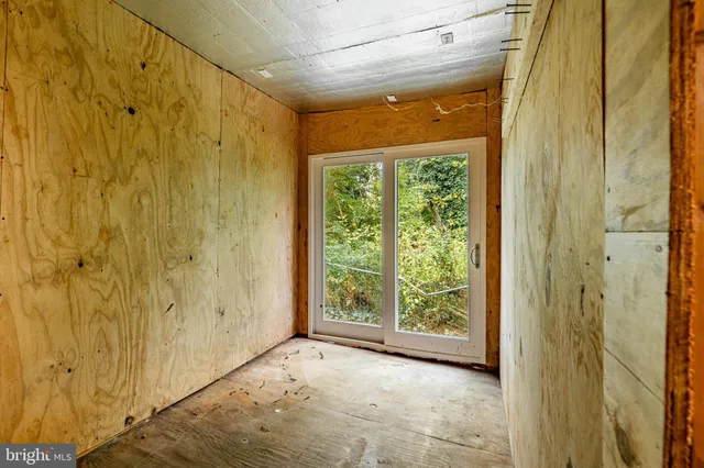 a view of a large window with yard in front of it