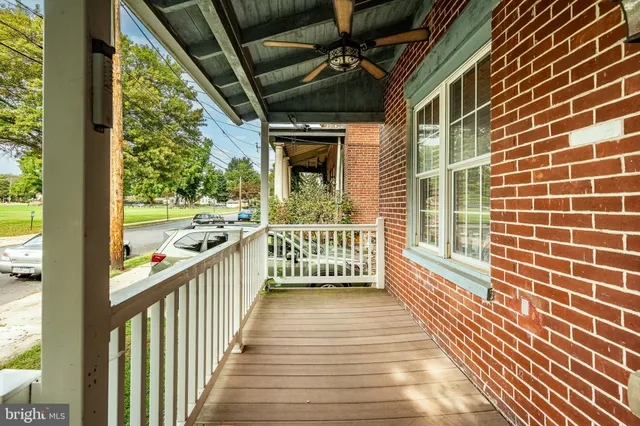 a view of a balcony with wooden floor