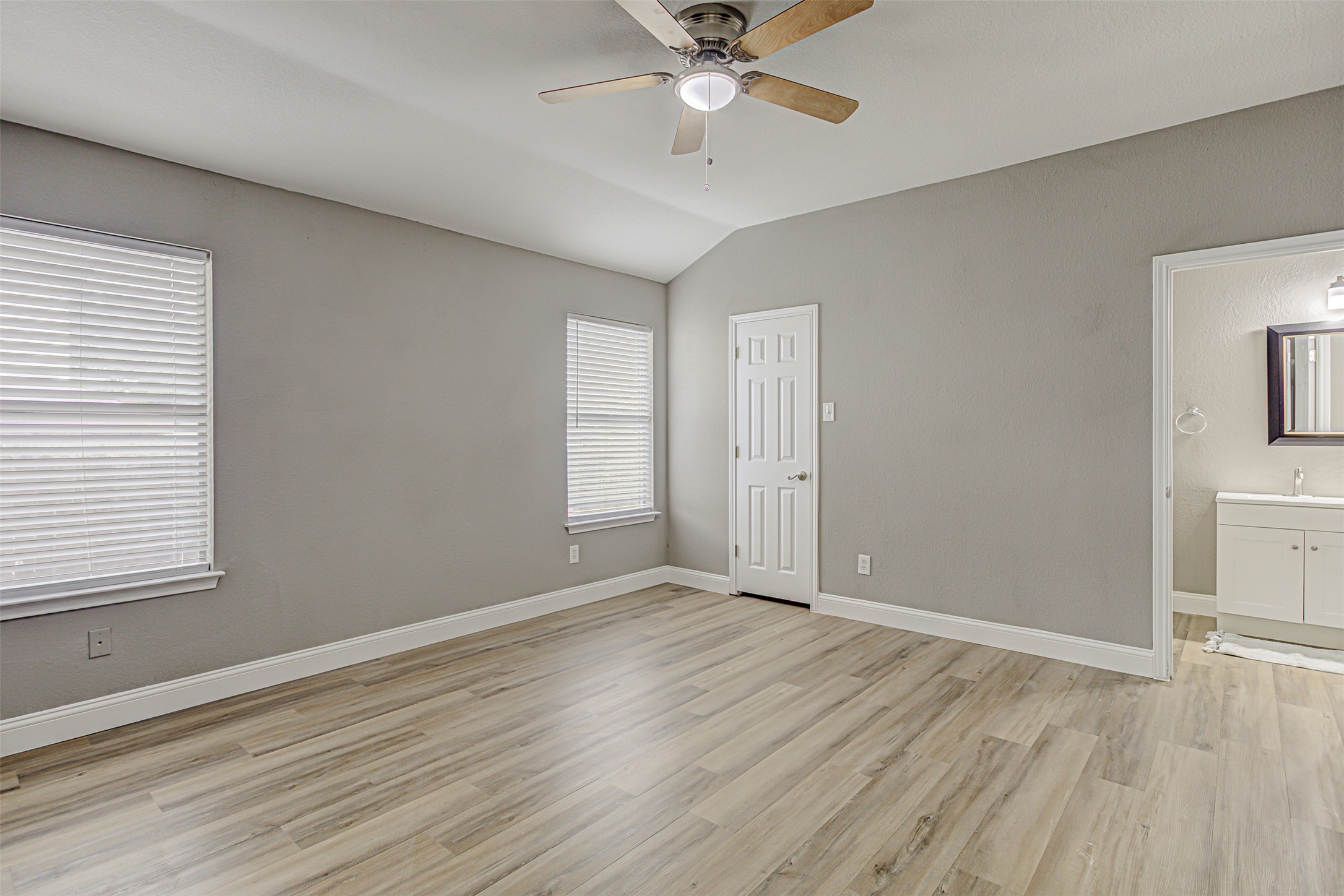 17838 Loch Linnhe Loop Pflugerville, TX 78660 - Photo 13 of 35 an empty room with wooden floor fan and windows