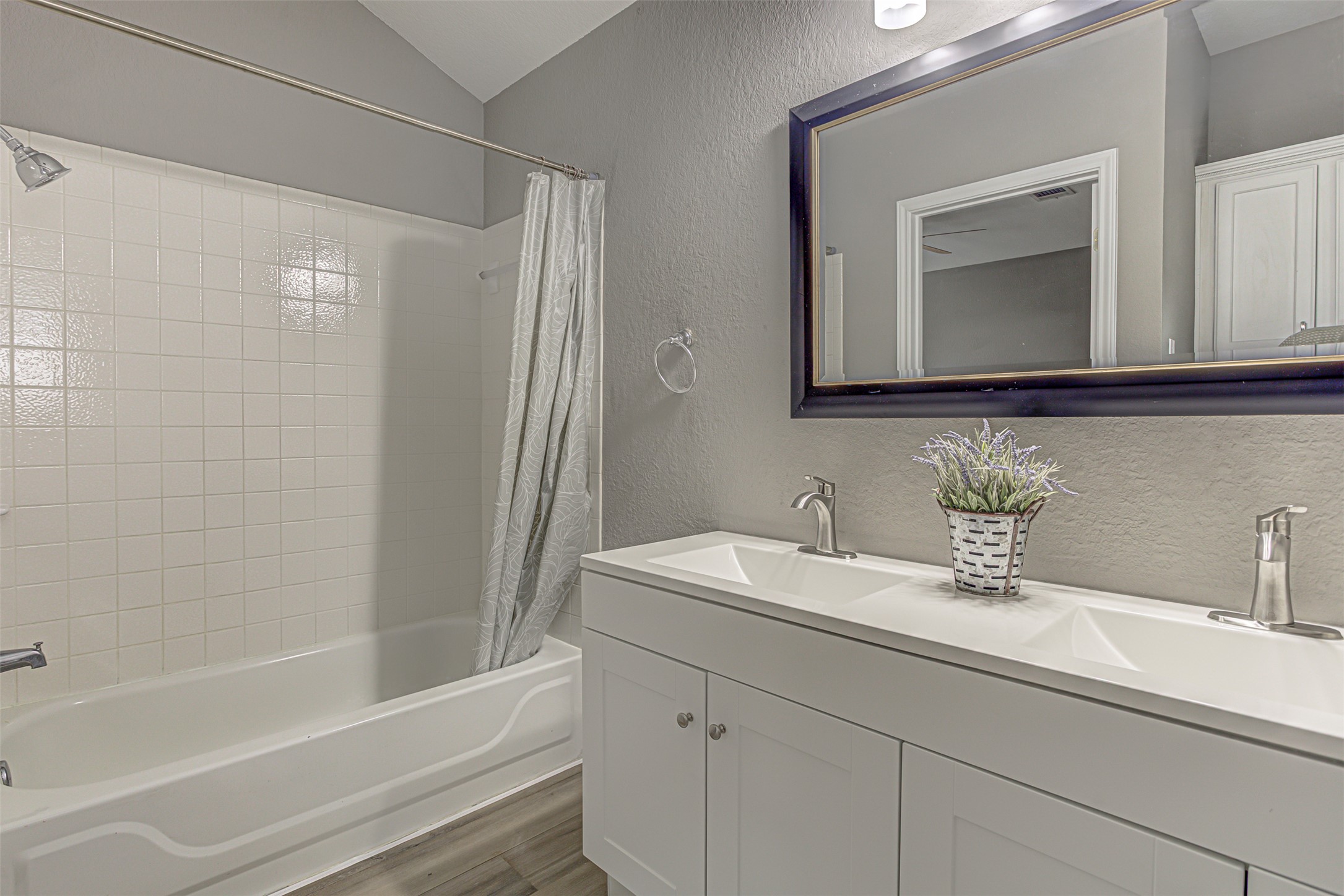 17838 Loch Linnhe Loop Pflugerville, TX 78660 - Photo 15 of 35 a bathroom with a sink and a mirror