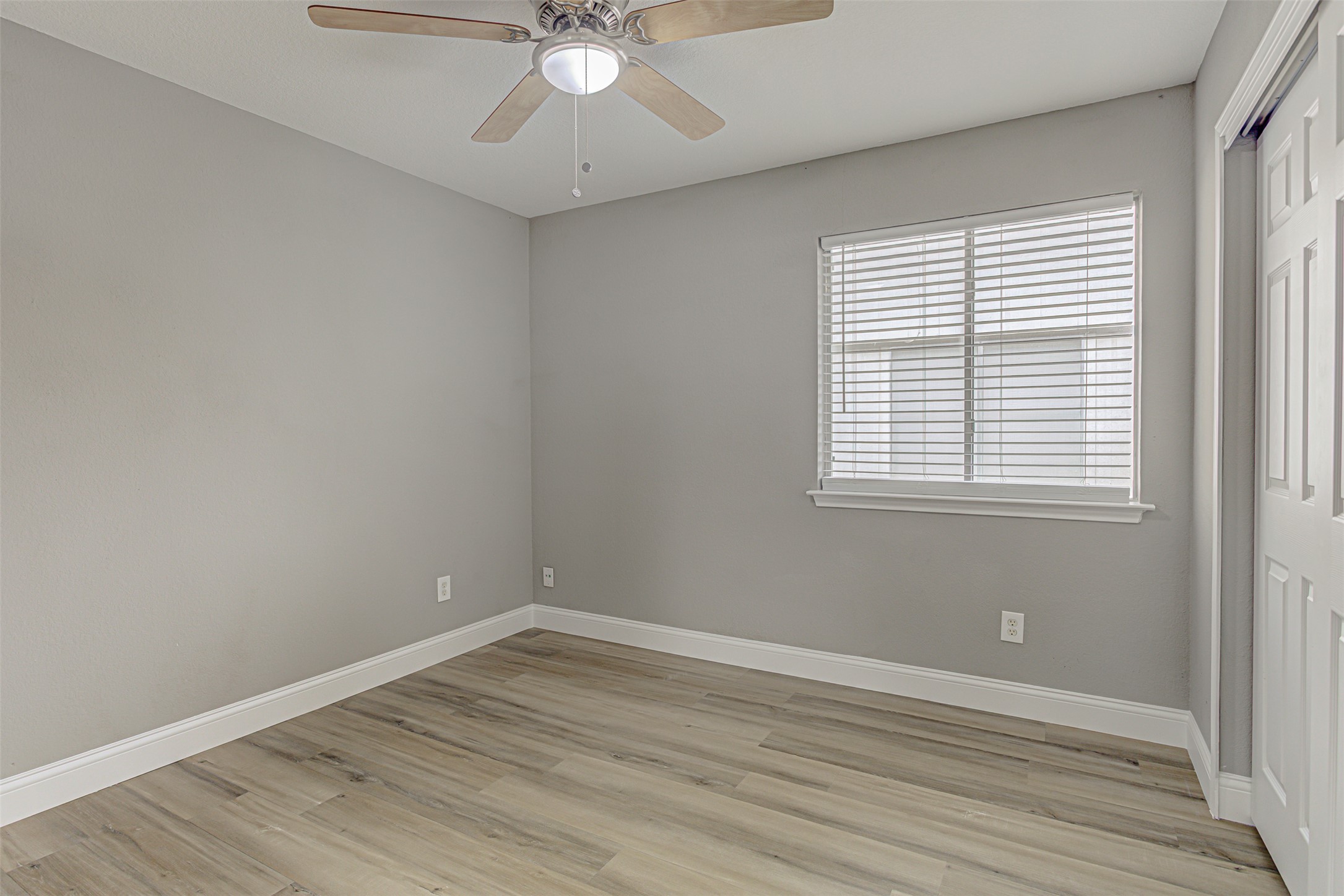 17838 Loch Linnhe Loop Pflugerville, TX 78660 - Photo 18 of 35 a view of an empty room with wooden floor and a window