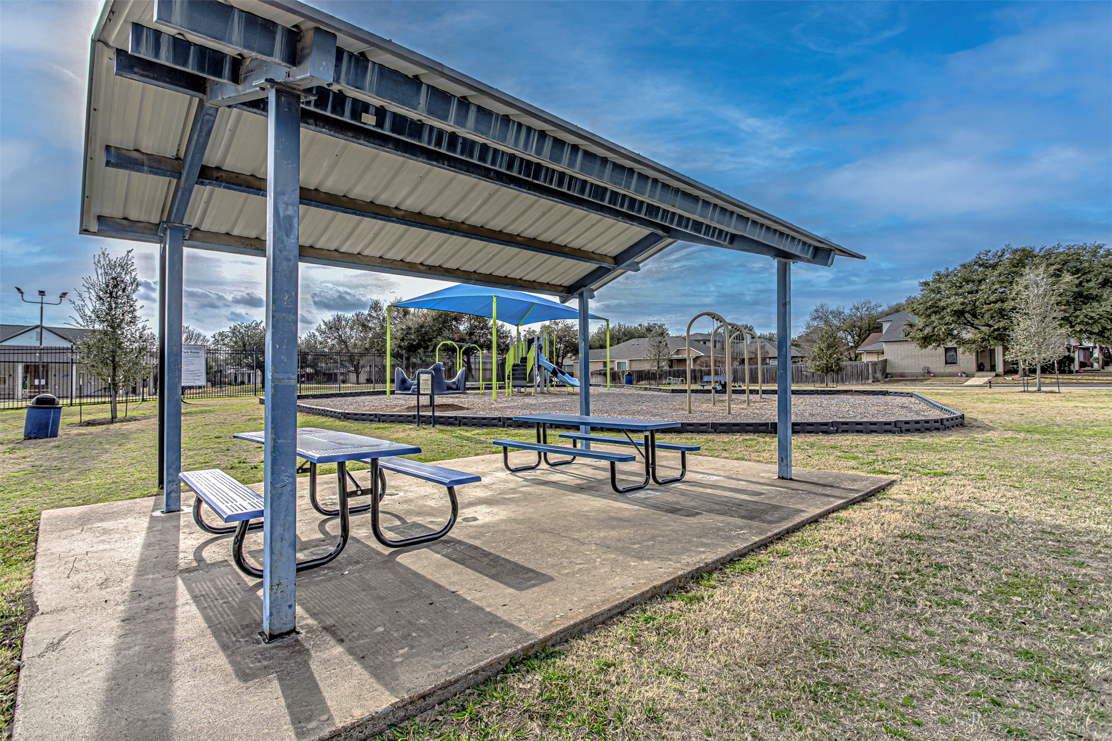 17838 Loch Linnhe Loop Pflugerville, TX 78660 - Photo 33 of 35 a view of a swimming pool with a bench and lawn chairs