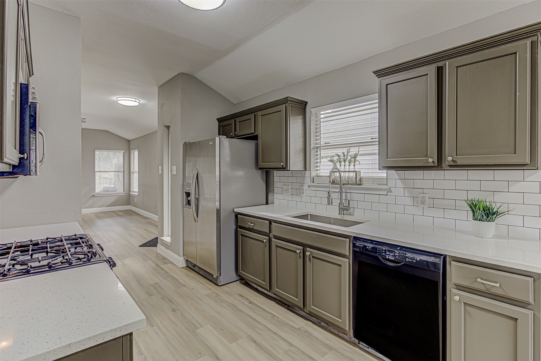 17838 Loch Linnhe Loop Pflugerville, TX 78660 - Photo 8 of 35 a kitchen with a sink stove and refrigerator