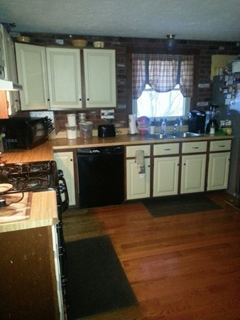 45 Sassawanna Road Rutland, MA 01543 - Photo 9 of 27 a kitchen with granite countertop a stove and a sink