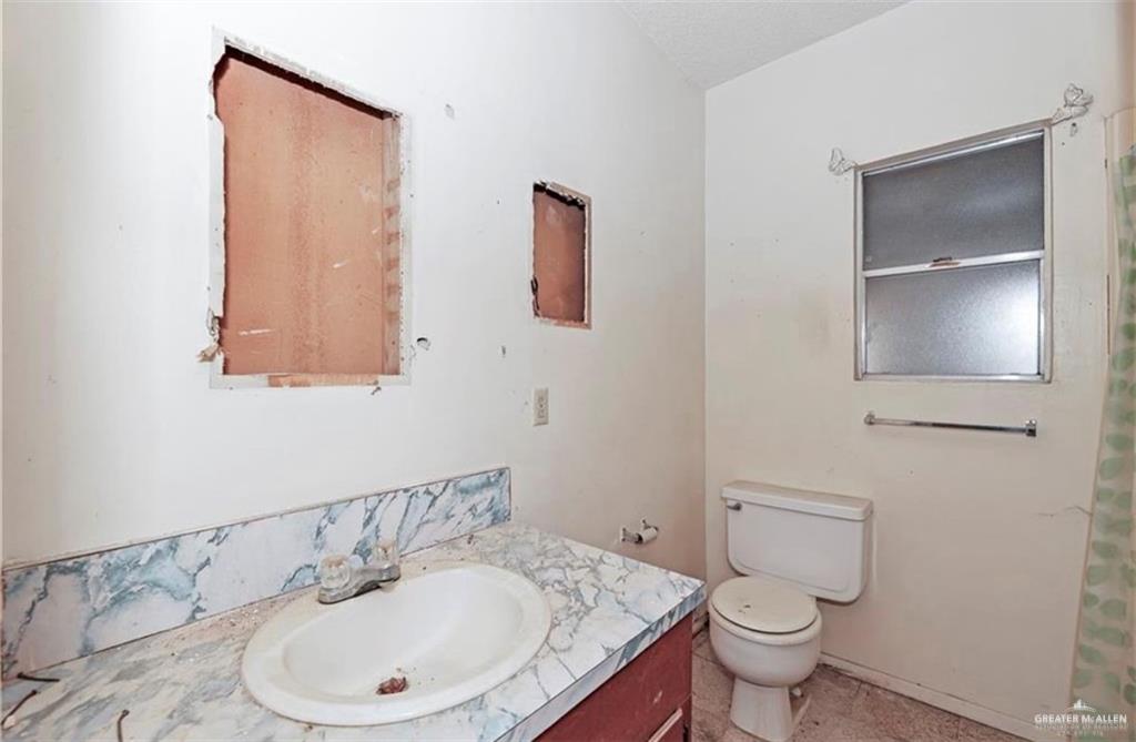 107 East Main Street Rio Grande City, TX 78582 - Photo 12 of 16 Full bath with vanity and toilet