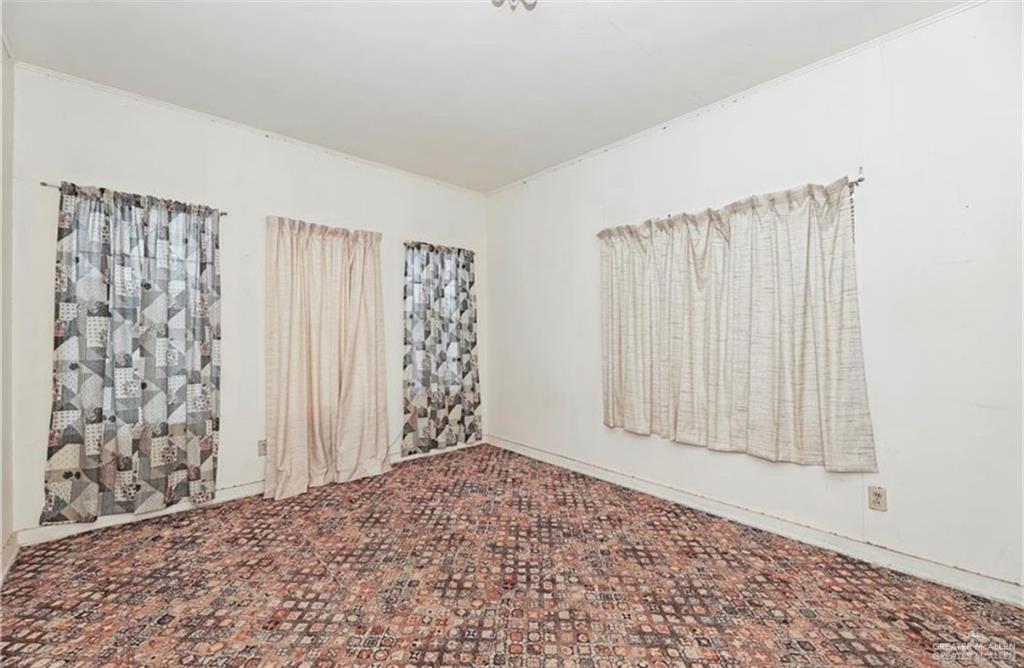107 East Main Street Rio Grande City, TX 78582 - Photo 8 of 16 View of carpeted spare room