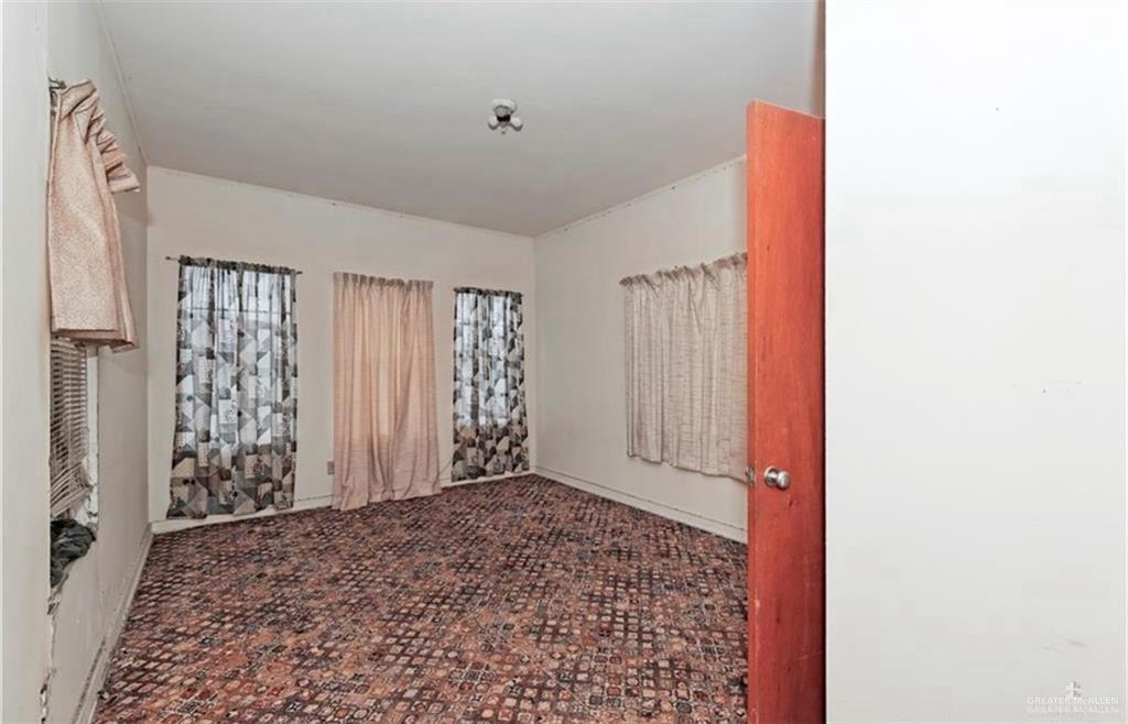 107 East Main Street Rio Grande City, TX 78582 - Photo 9 of 16 View of carpeted empty room