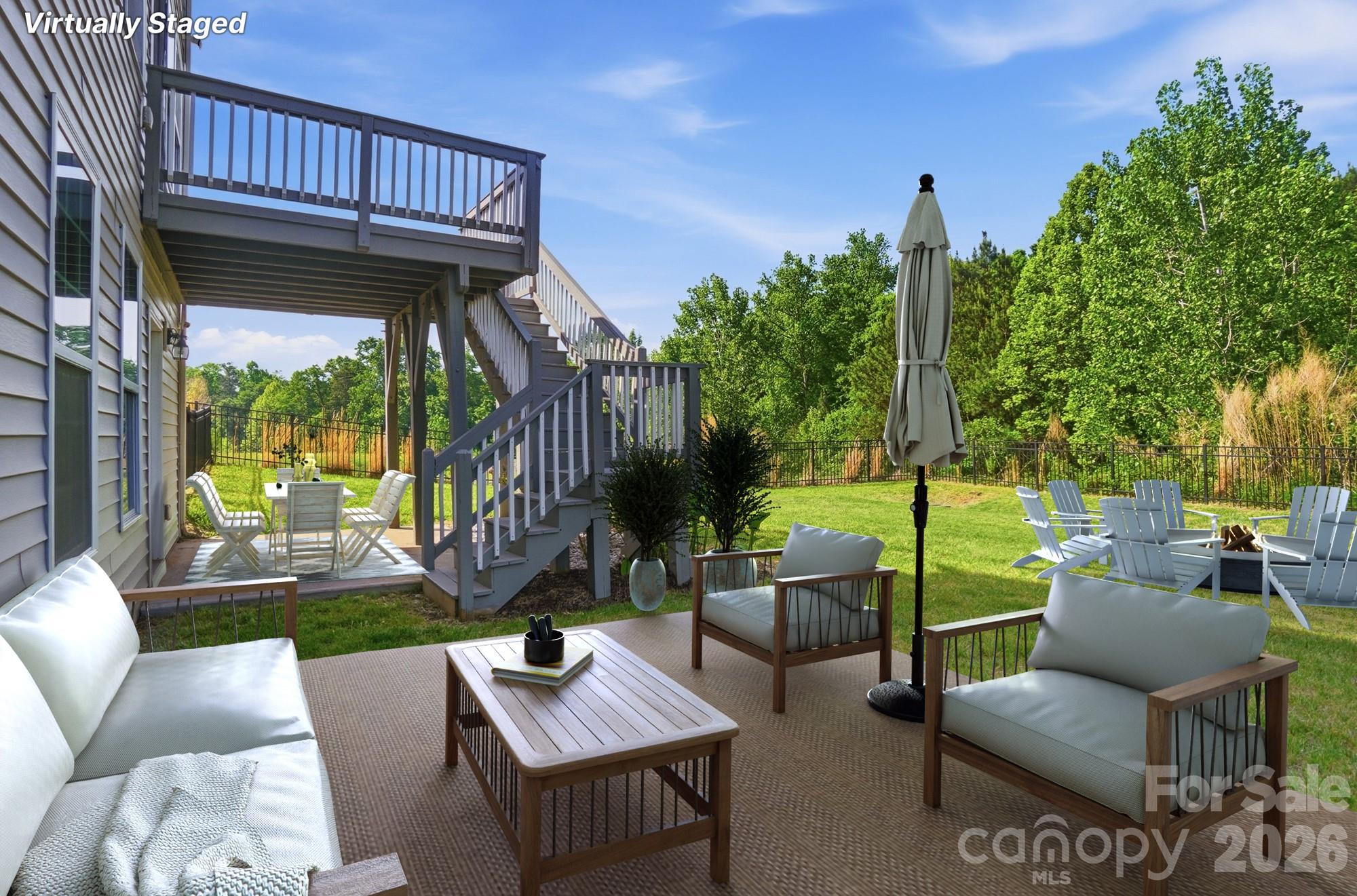 9407 Inverness Bay Road Charlotte, NC 28278 - Photo 28 of 29 a view of a patio with couches chairs and a table and chairs with wooden floor