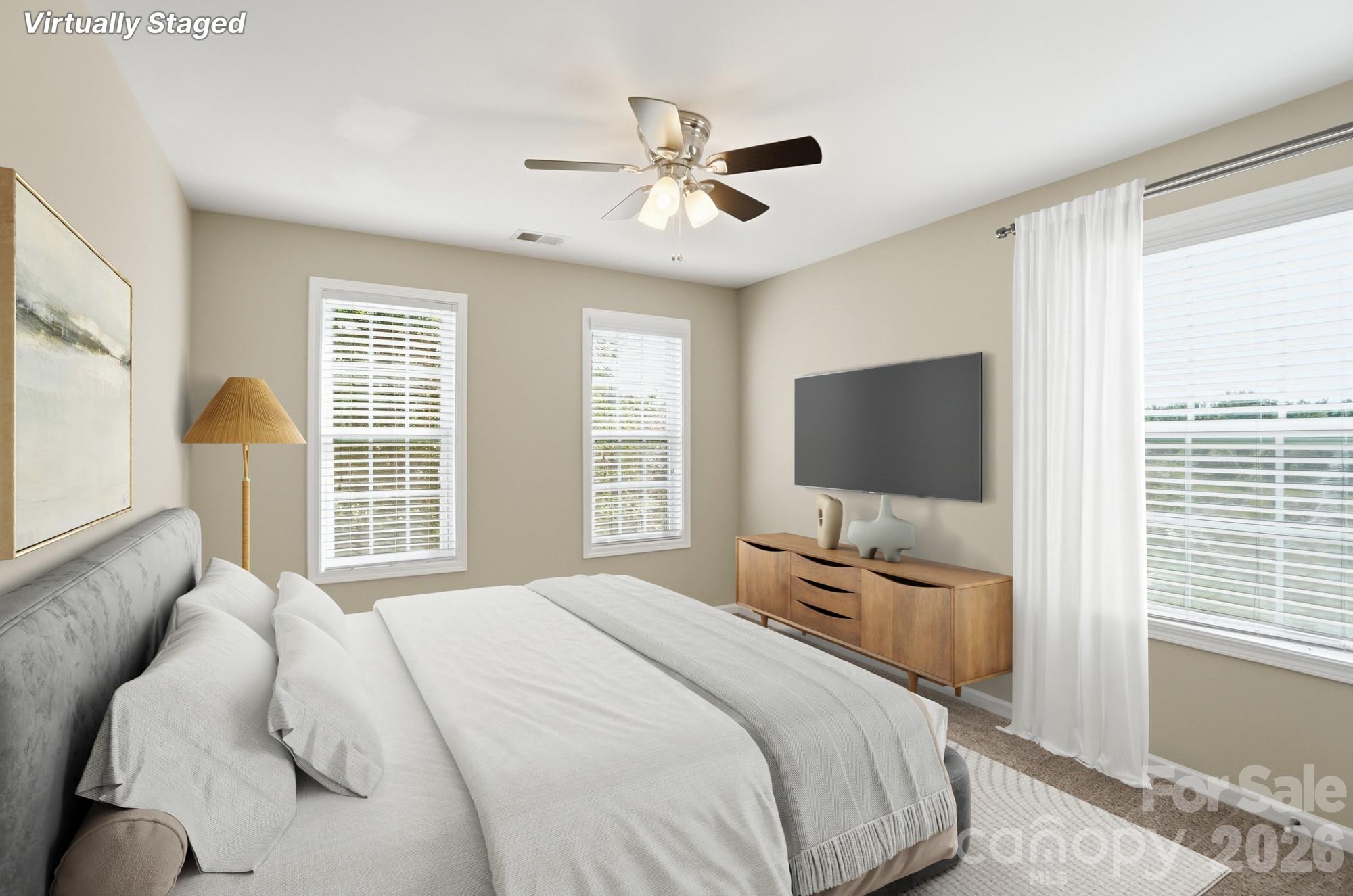 9407 Inverness Bay Road Charlotte, NC 28278 - Photo 8 of 29 a bedroom with a bed window and flat screen tv