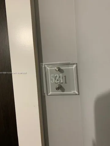 an empty room with a wooden door