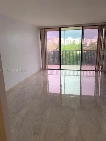 a view of a room with sliding glass door