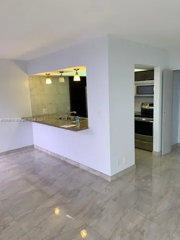 a view of an empty room with a sliding door