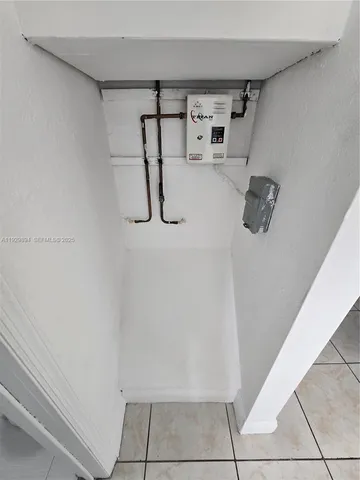 a view of storage and utility room with racks on the wall