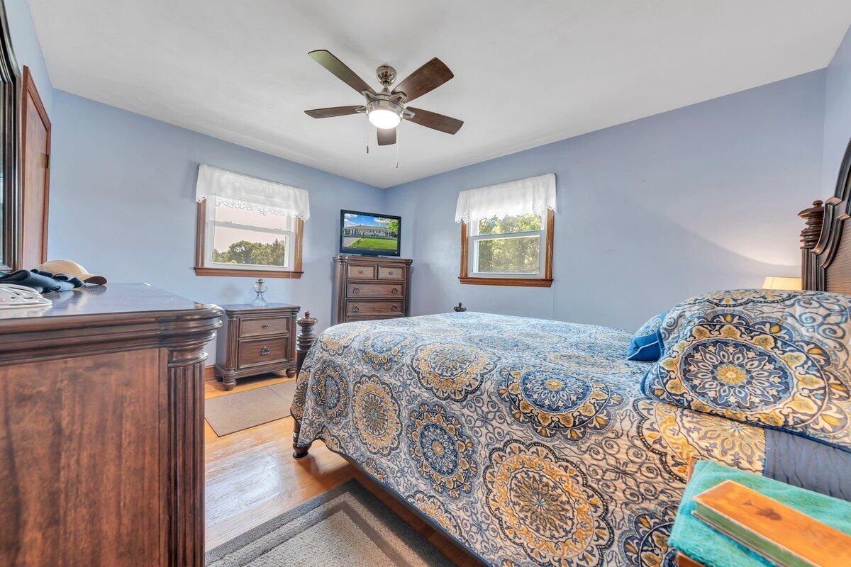 3226 Rakes Road Rocky Mount, VA 24151 - Photo 35 of 74 a bedroom with a bed and a dresser next to a window