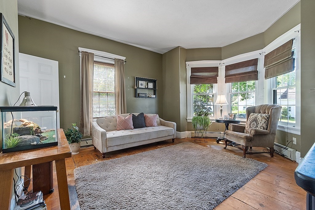 32 Ash Street Winchendon, MA 01475 - Photo 15 of 42 a living room with furniture and a large window