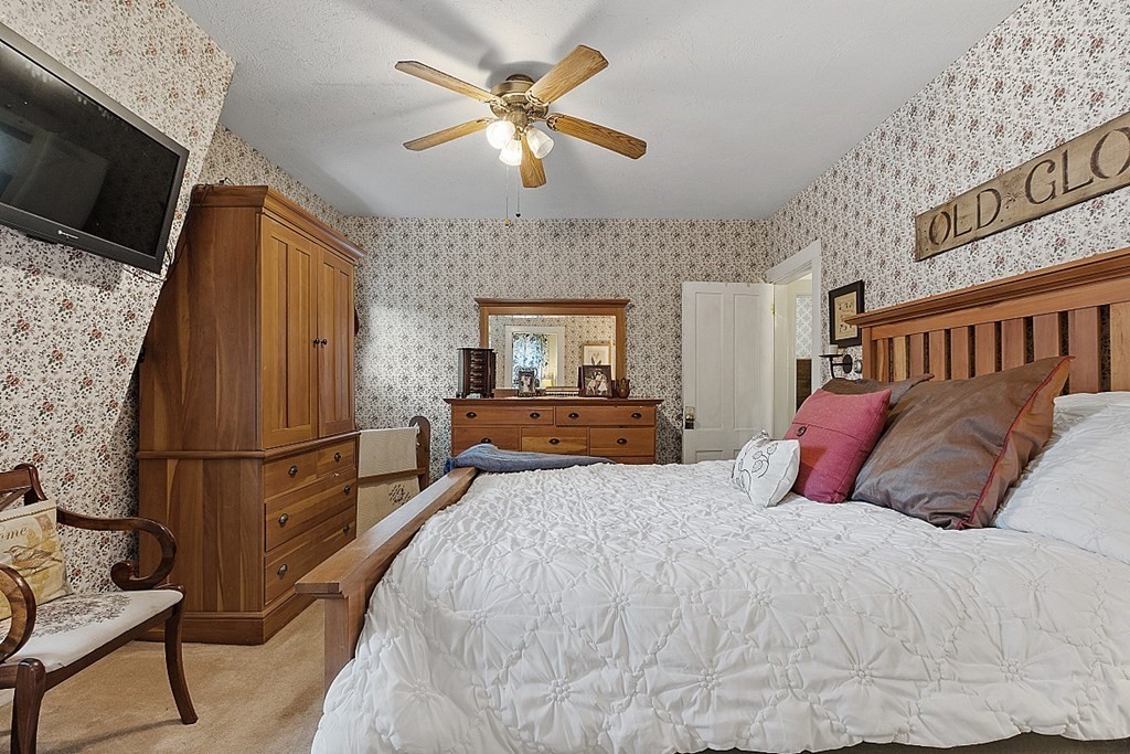 32 Ash Street Winchendon, MA 01475 - Photo 21 of 42 a bedroom with a bed and a flat screen tv