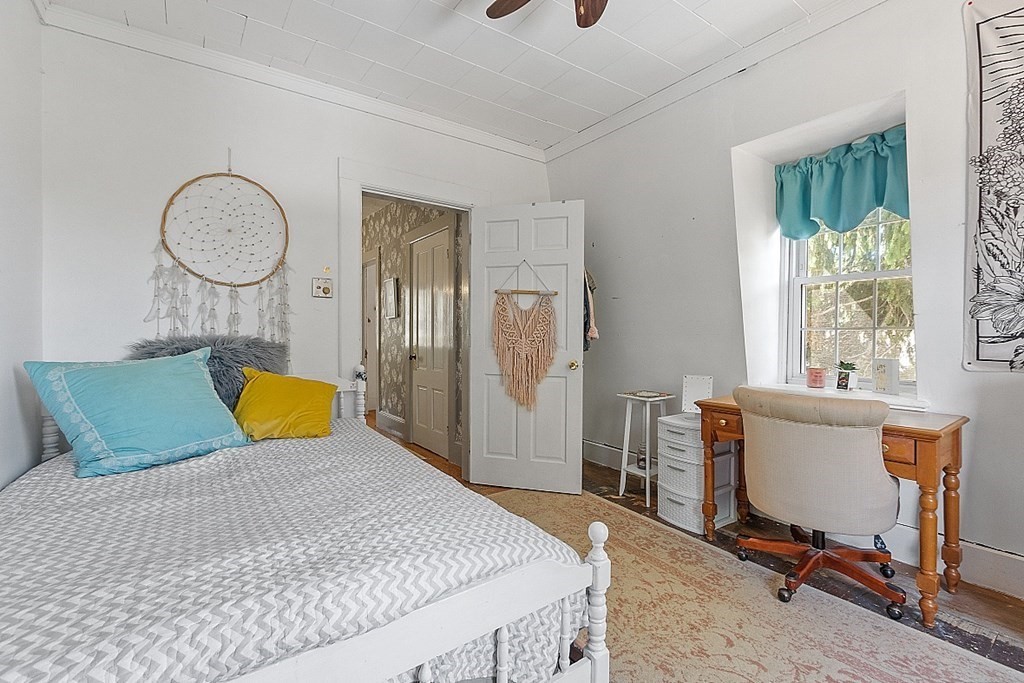 32 Ash Street Winchendon, MA 01475 - Photo 27 of 42 a bed room with a bed mirror table chair and a window