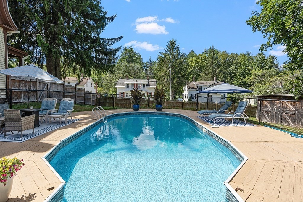 32 Ash Street Winchendon, MA 01475 - Photo 36 of 42 a swimming pool with outdoor seating and yard