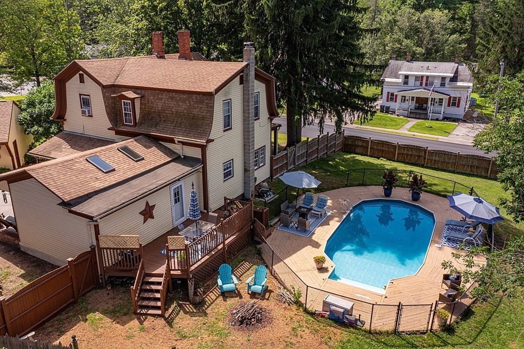 32 Ash Street Winchendon, MA 01475 - Photo 37 of 42 a view of a chairs and table in a backyard