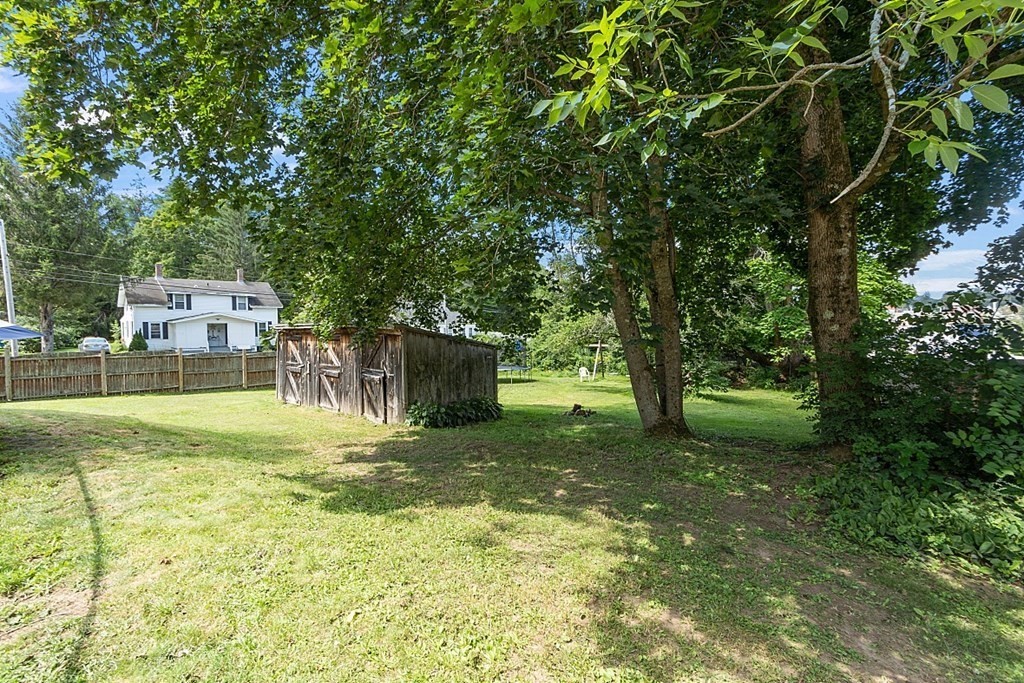 32 Ash Street Winchendon, MA 01475 - Photo 41 of 42 a view of a backyard with a small cabin