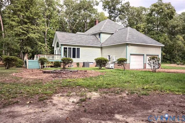 a backyard of a house with lots of trees