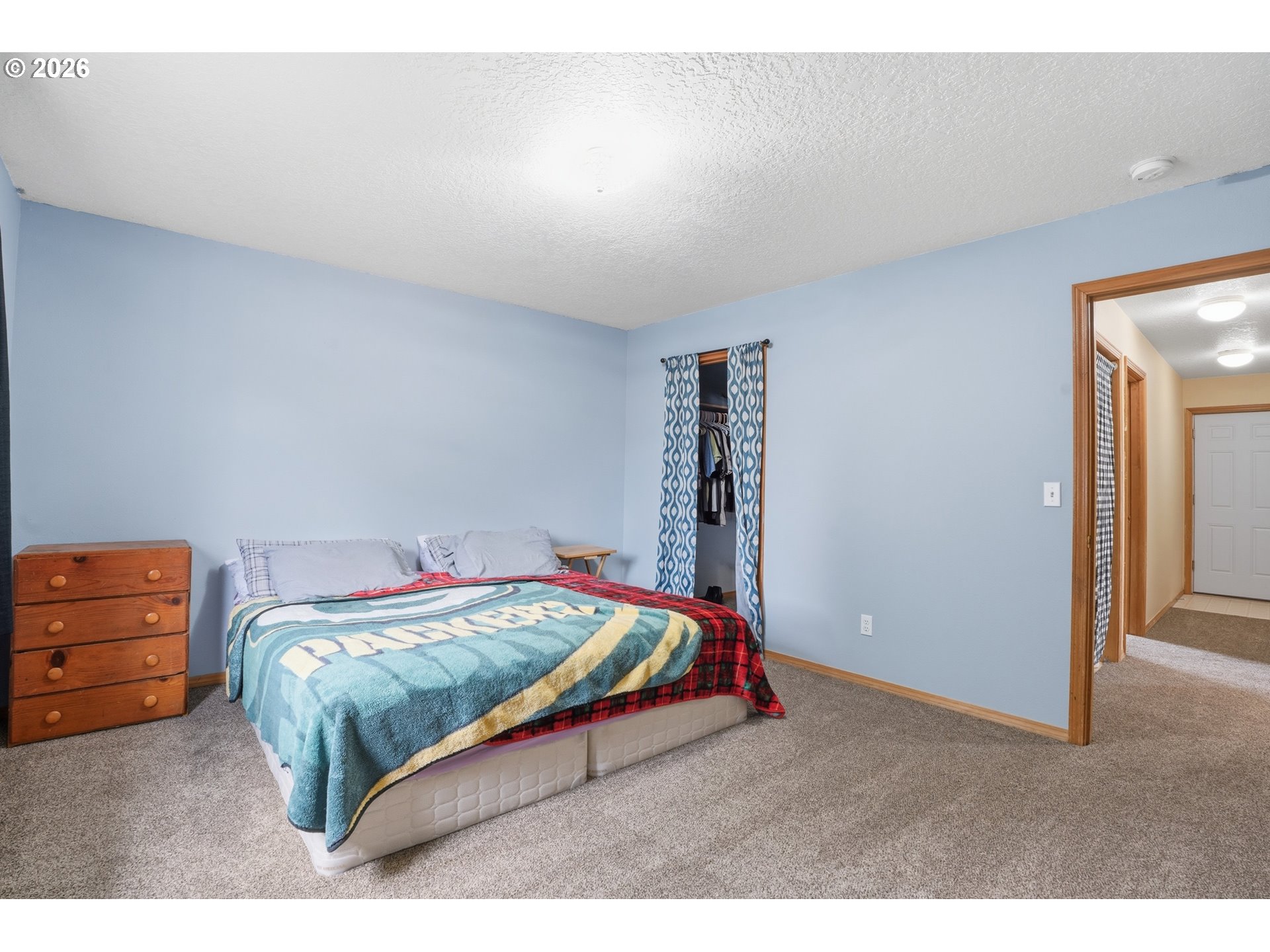 105 Toliver Road Molalla, OR 97038 - Photo 16 of 34 a bedroom with a bed and a chandelier