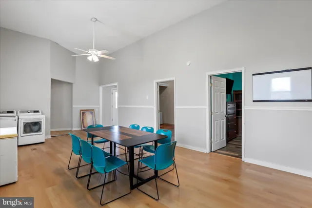 a dining room with furniture and window