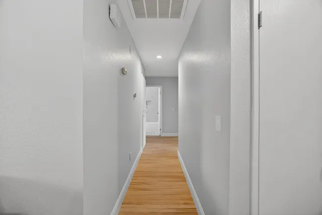 a view of a bathroom from a hallway