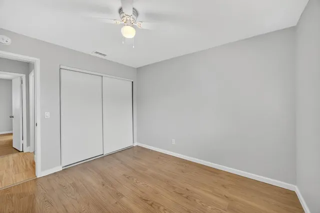 a view of room with wooden floor