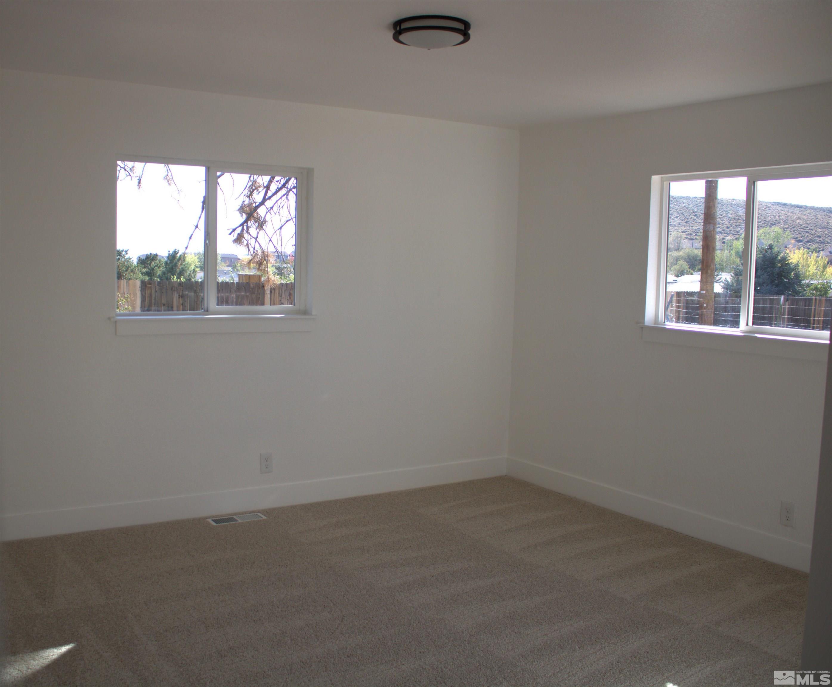 1445 Newcomer Lane Reno, NV 89506 - Photo 13 of 26 an empty room with a window